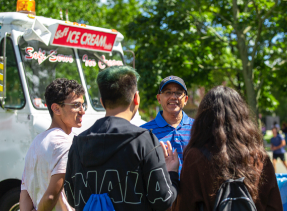 President Chrite with ice cream truck and students 