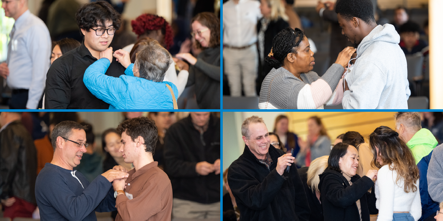 Bentley First-Gen students receiving pins from their families and friends