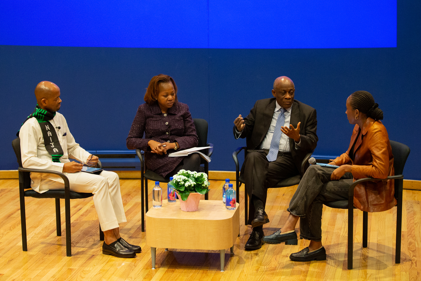 Panel presenters at the African Business Conference converse on stage