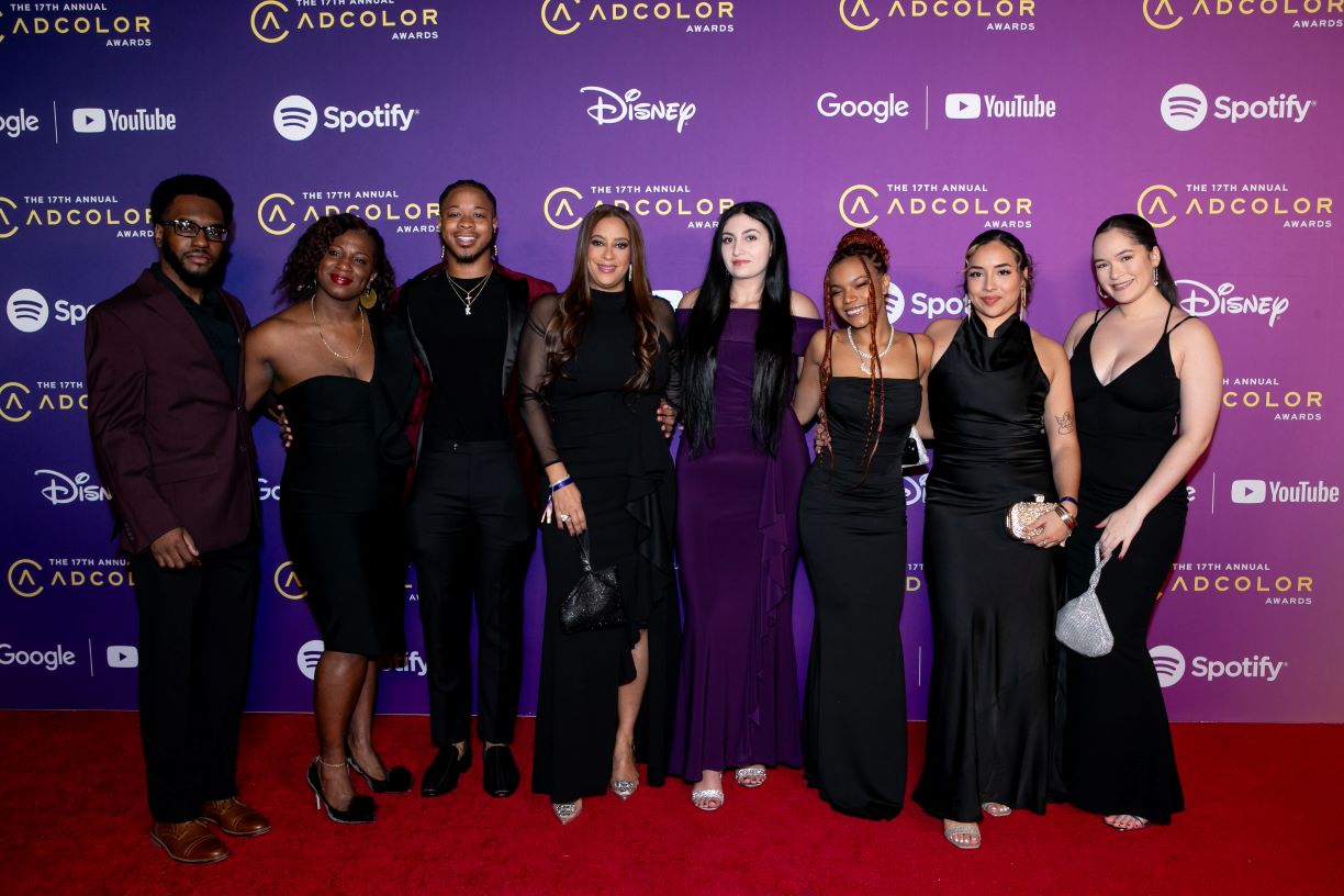 Bentley community members pose in front of backdrop at ADCOLOR 2023 conference