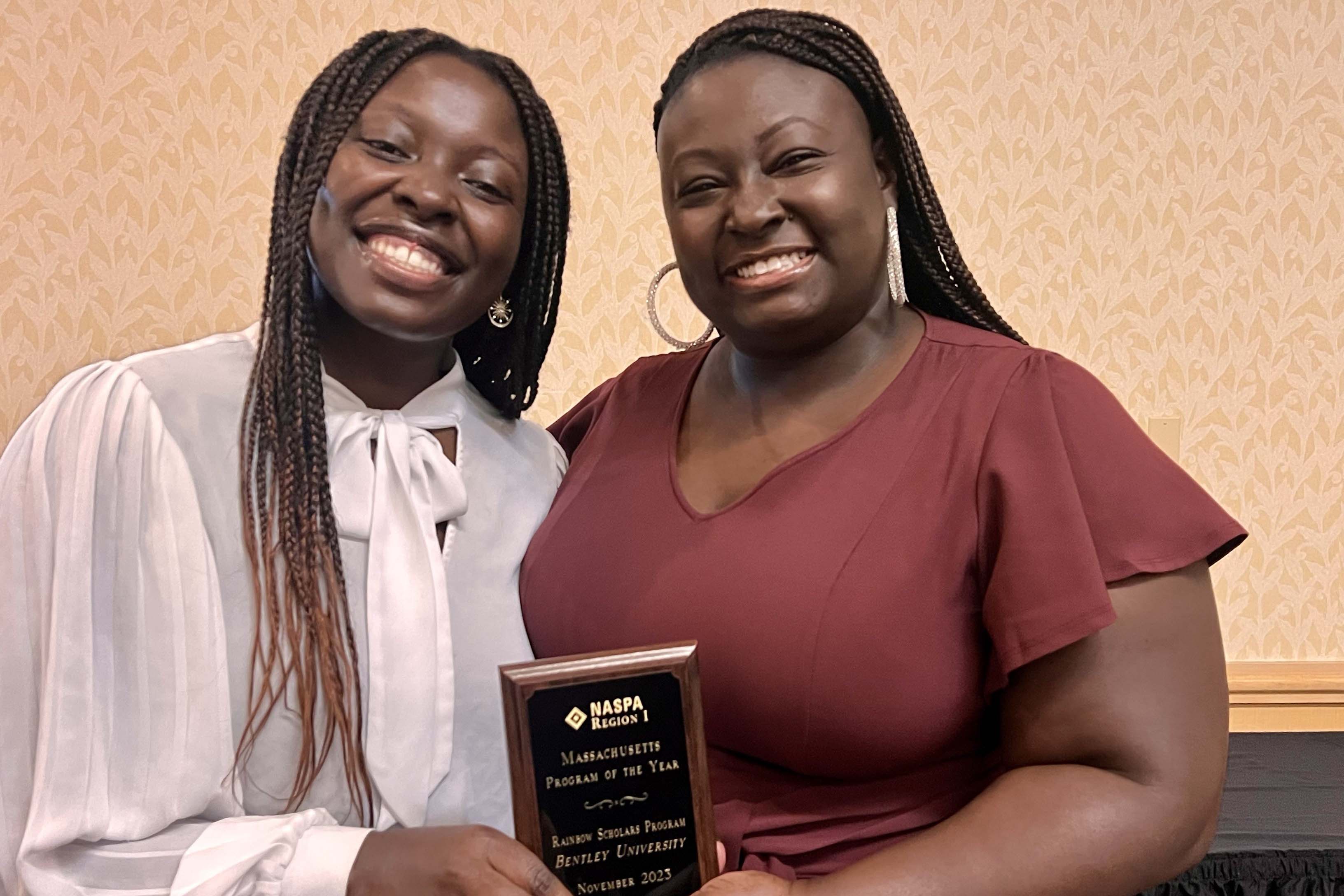 Dominique Wilburn and Nana Adu accept the NASPA Award 