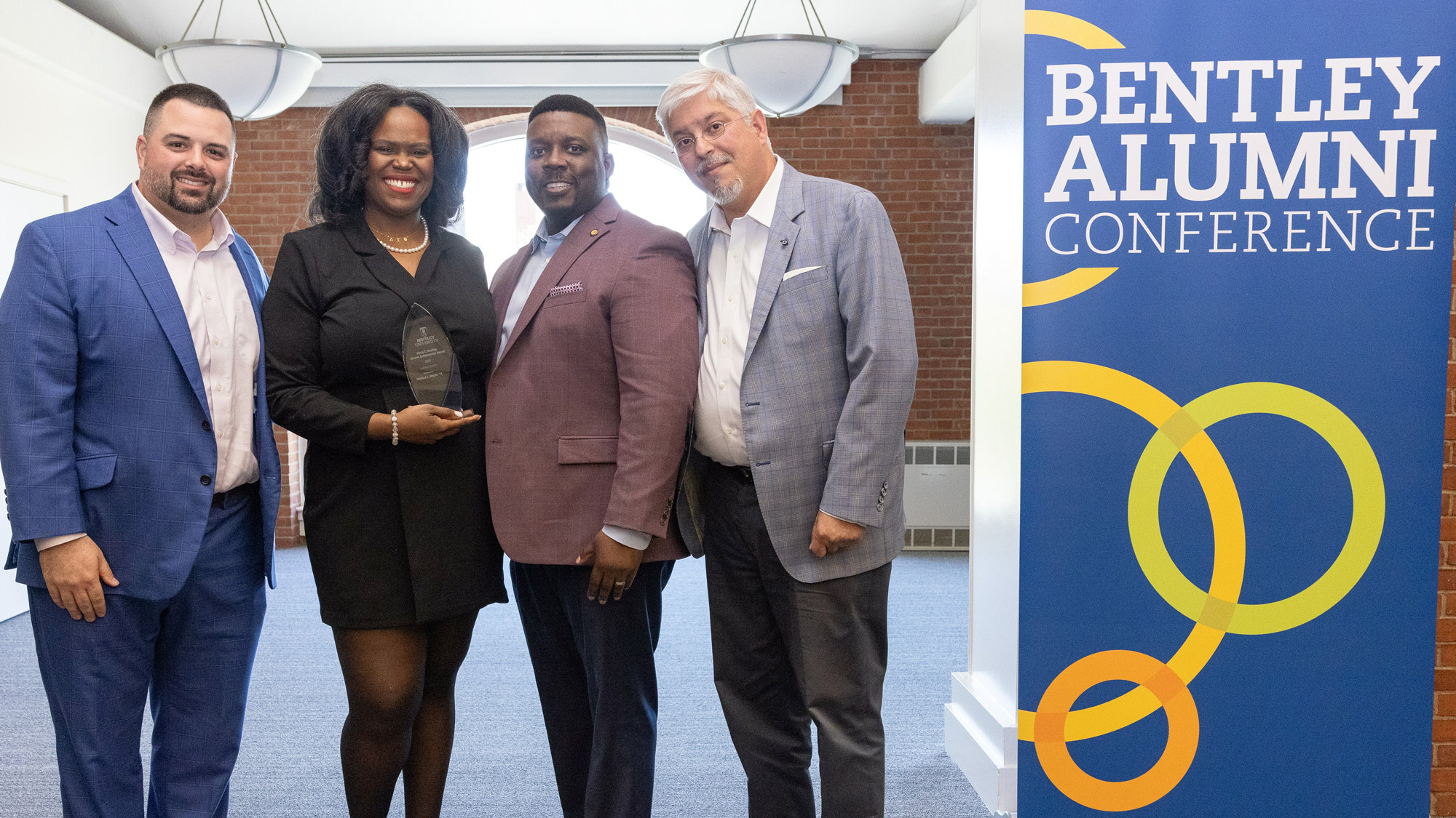 alumni pose for a photo during the Bentley Alumni Conference