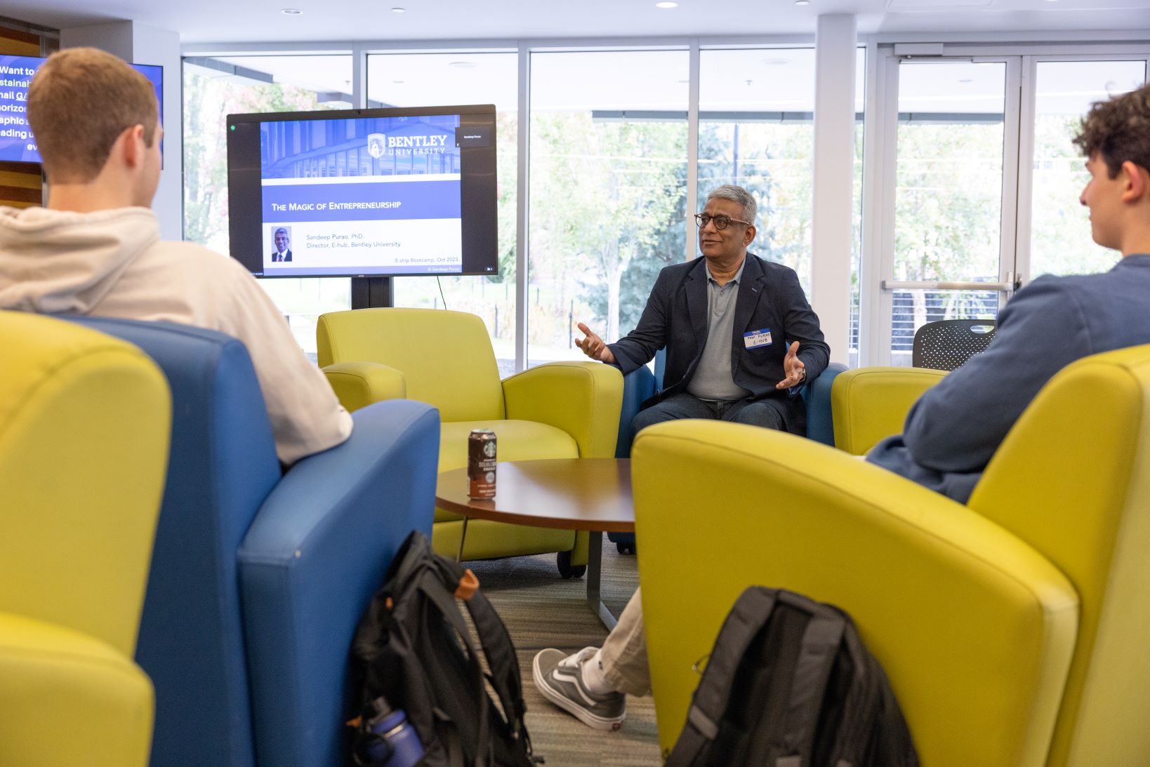 Two students listening to a professor