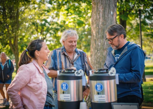 Paul Delmonico serves shoppers buying Dels coffee