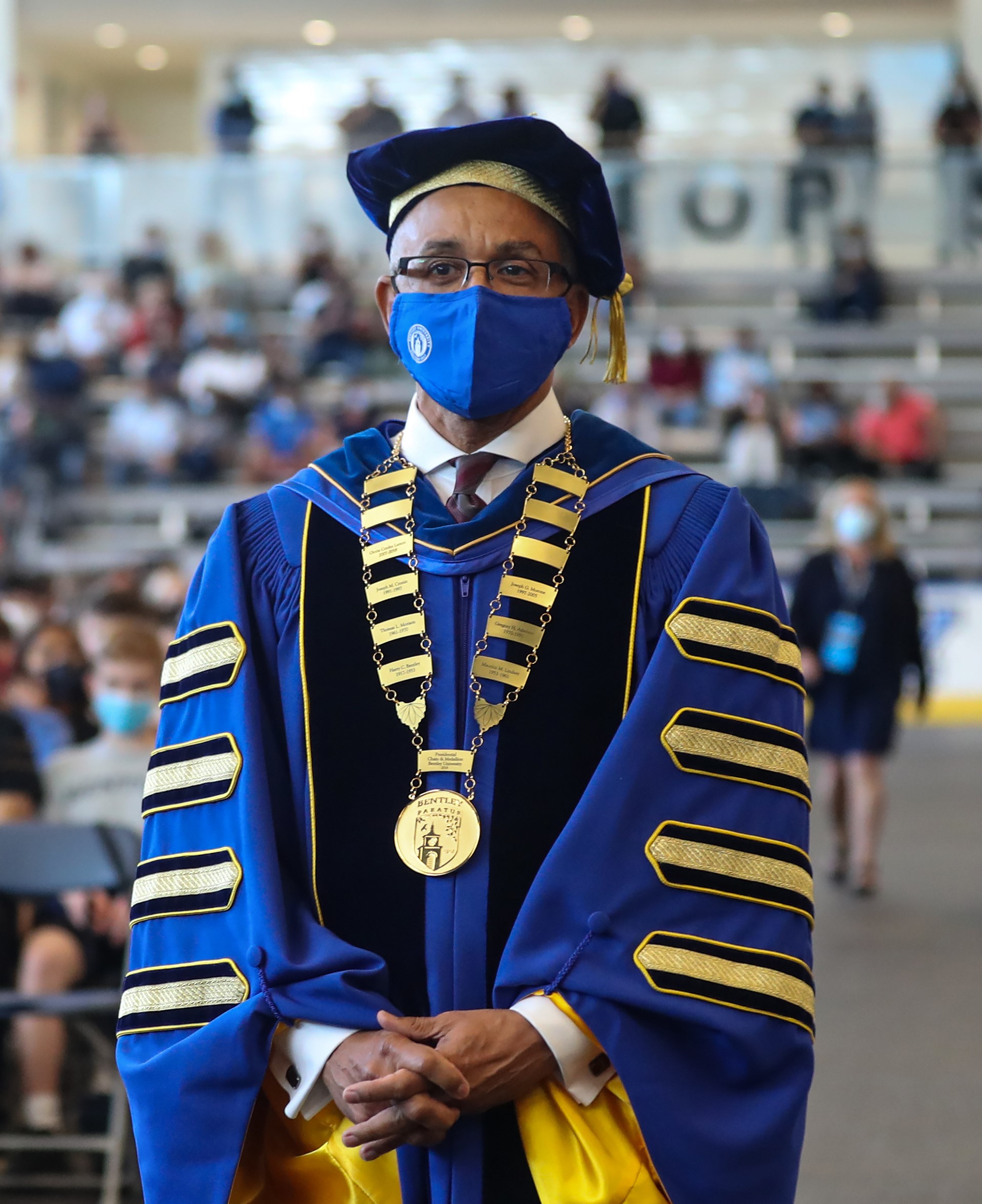 Bentley University President Brent Chrite walks down the aisle at convocation 2021