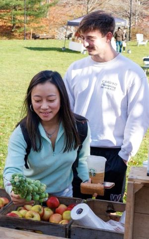 Students at table at farmer's market 