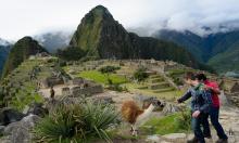 two students study abroad and visit machu picchu 