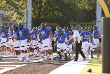 Football team entering the field