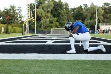 Football player on one knee 