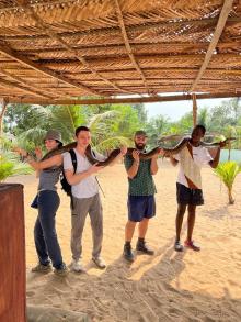 students holding snake