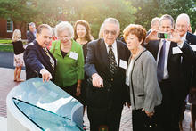 a group meets by the Great Benefactors dedication 