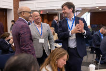 Bentley president E. LaBrent Chrite and Center for Health and Business director of business development Andy Donovan chat with a summit participant.