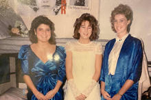 Three women dressed for a dance