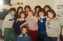 Group of women in a dorm room wearing Bentley sweatshirts