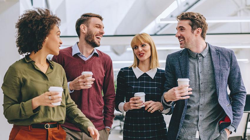 Photo of four young professionals