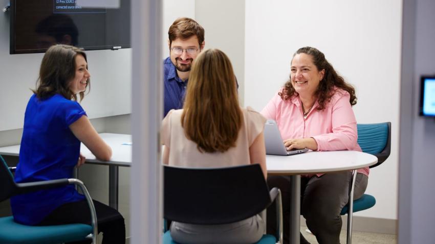 Faculty meeting around table