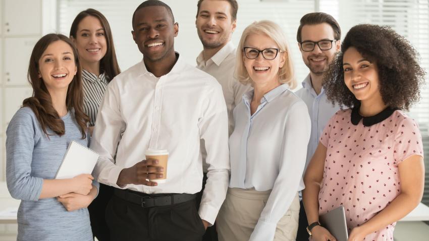 Diversity, Equity, and Inclusion diverse team standing and smiling