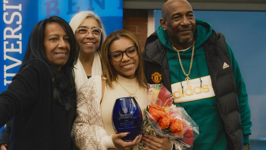 Bentley university student Jaychele Nicole Schenck ’26 poses with her Dr. Earl L. Avery MLK Leadership Award at the annual MLK social justice event