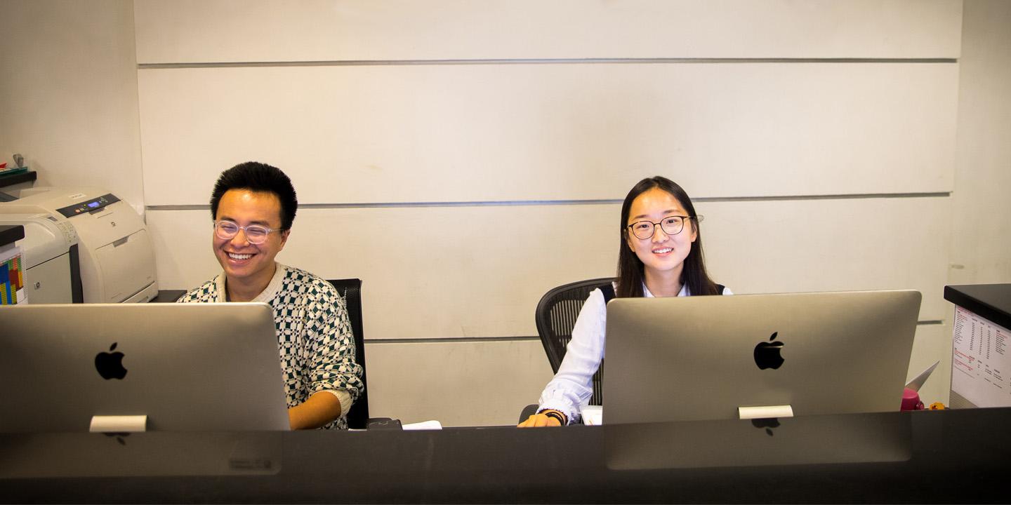 two students work at computer