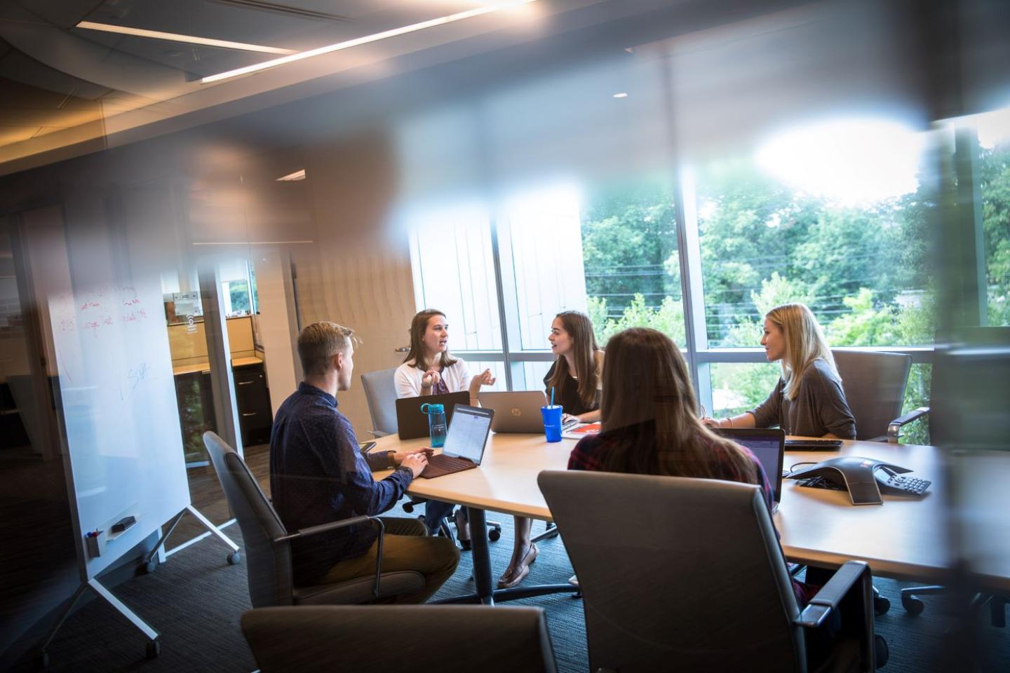 students at conference table