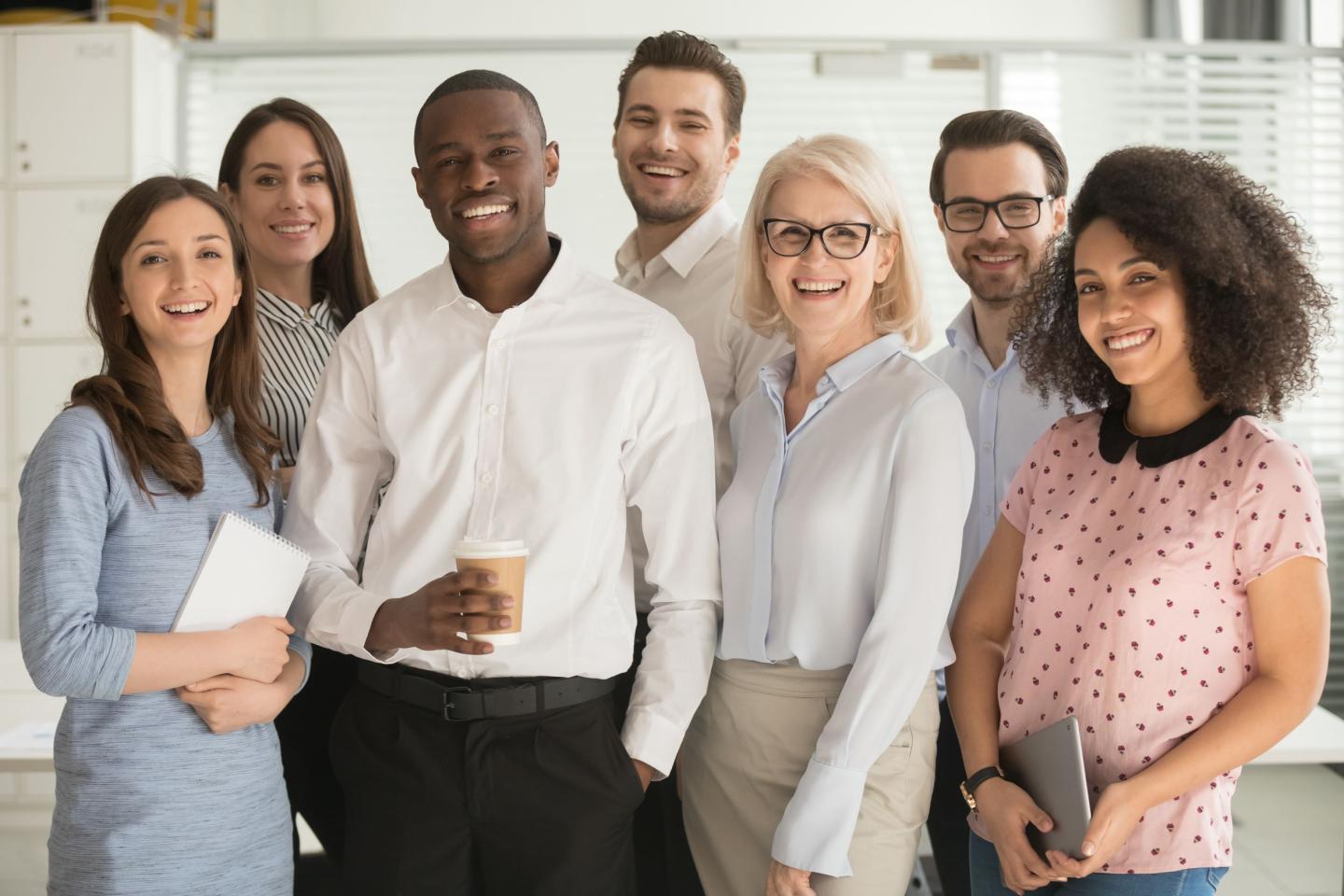 Diversity, Equity, and Inclusion diverse team standing and smiling