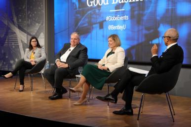 Panelists Melanie Foley, MBA ’02, executive vice president and chief administrative officer at Liberty Mutual Insurance; Ron O’Hanley, CEO at State Street; and Alicia Rose, deputy CEO of strategic initiatives at Deloitte US sitting on a stage with moderator and Bentley president E. LaBrent Chrite