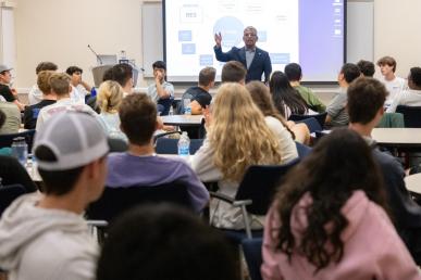 Trustee Professor Sandeep Purao speaks with students about the university's new E-Hub initiative during a meeting of the Bentley Entrepreneurship Society.