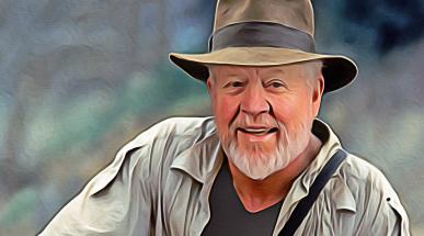 Photo illustration of professor Dan Everett reimagined as Indiana Jones, wearing a tan fedora and khaki shirt