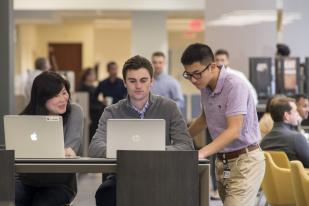 Bentley students in a workplace setting